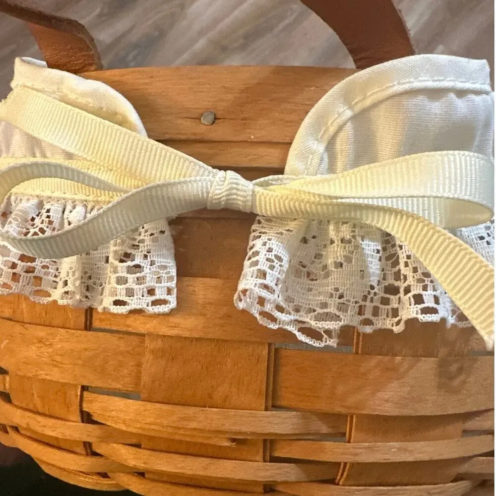Longaberger Round Basket 10”with leather handles lace trim liner 1990 signed.